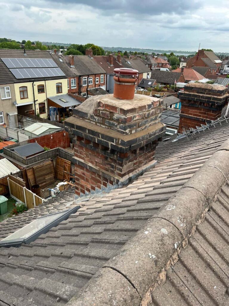 This is a photo taken from a roof which is being repaired by Clay Cross Roofing Repairs, it shows a street of houses, and their roofs